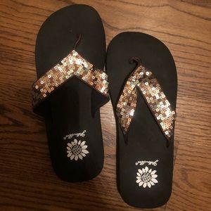 Yellow box sparkly flip flops